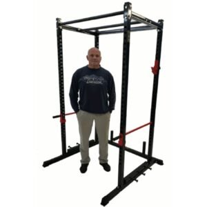 duuing standing next to black squat rack